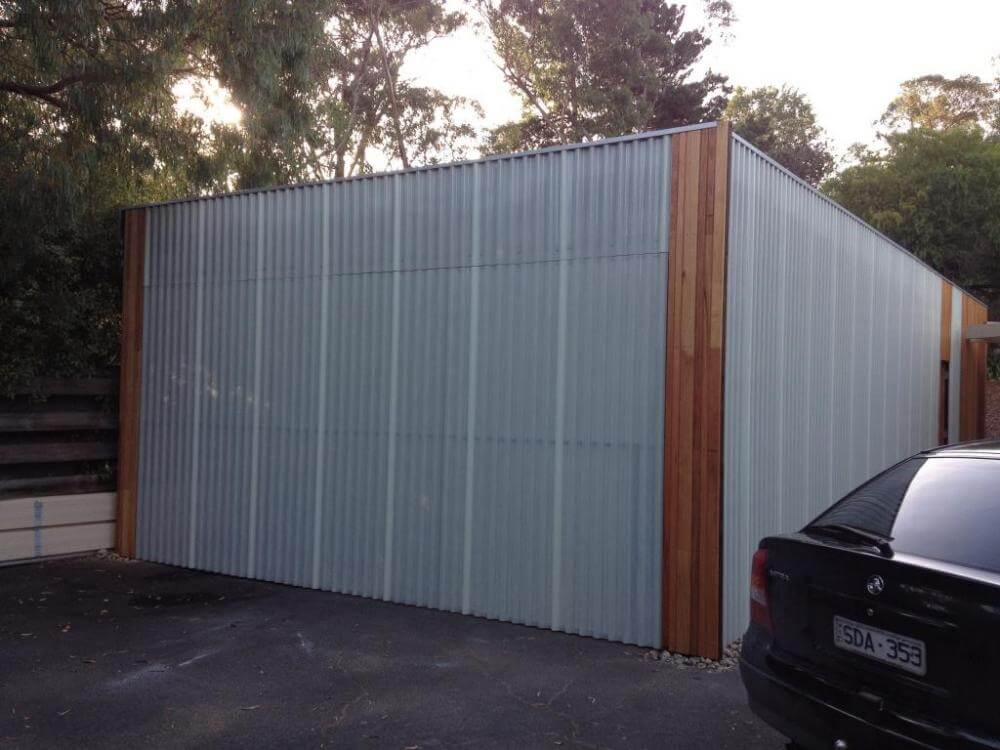 Aluminium and timber garage door design with custom paneling.