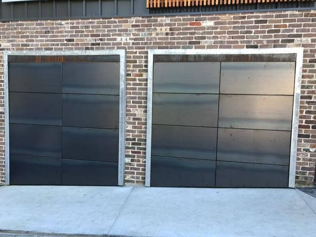 Corten front garage doors and carriage panel design inspiration