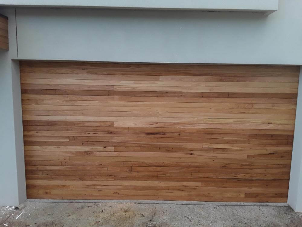 Horizontal hardwood garage door design and installation