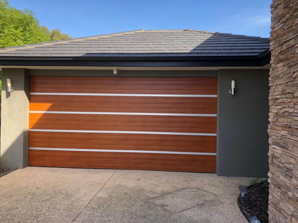 Anodised aluminium strappings and timber garage door design by Dandenong Garage Doors