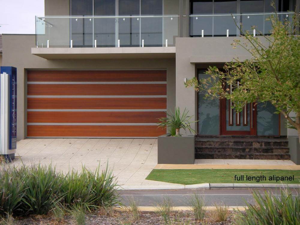Custom cedar and aluminium garage door design with Alipanel and highlight windows.