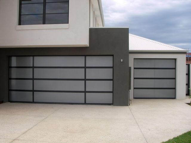 Aluminium sectional garage door with acrylic inserts on modern home in Dandenong, VIC