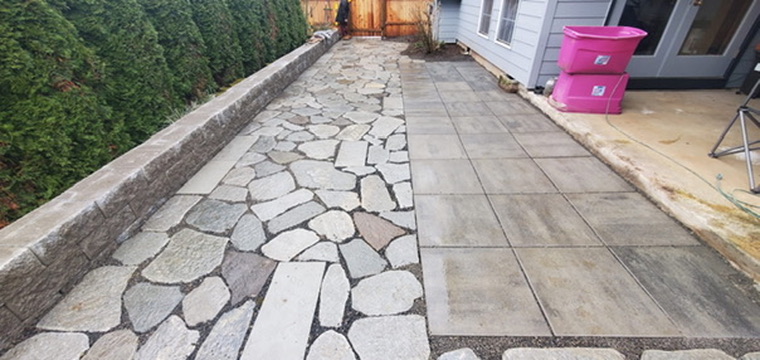 Mirella's natural flagstone and concrete paver patio walkway with stacked block retaining wall