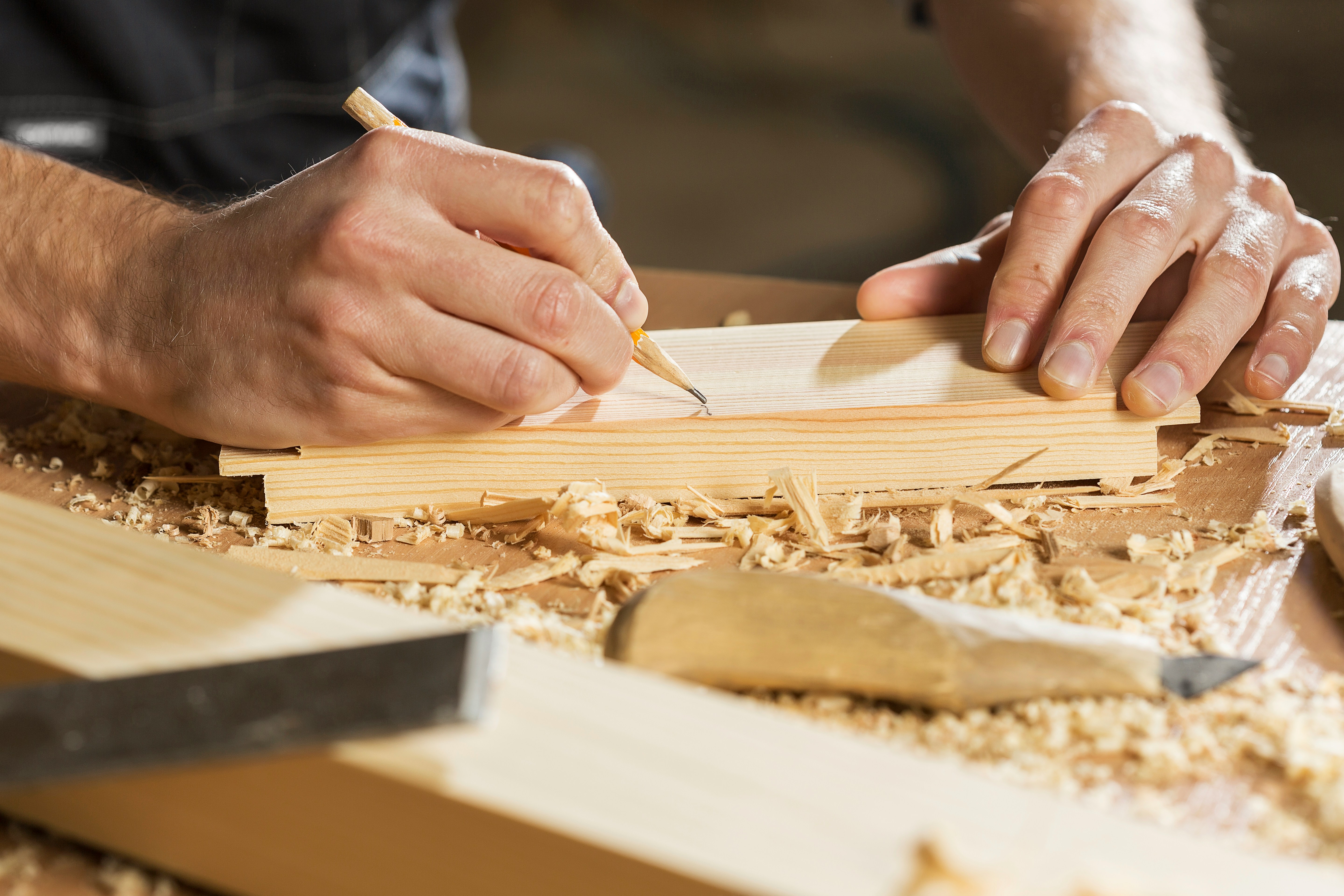 Master craftsman handcrafting architectural timber joinery