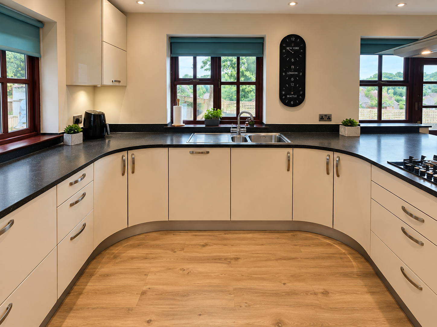 Close-up of scribed curved plinth and granite corner detail in a Sussex kitchen