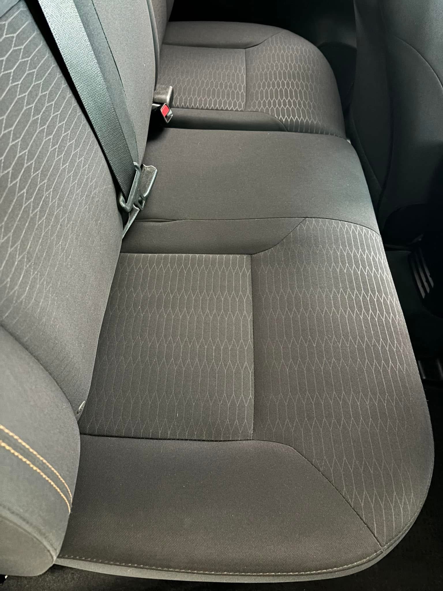 Vehicle cloth back seats after deep shampoo extraction, spotless and fresh