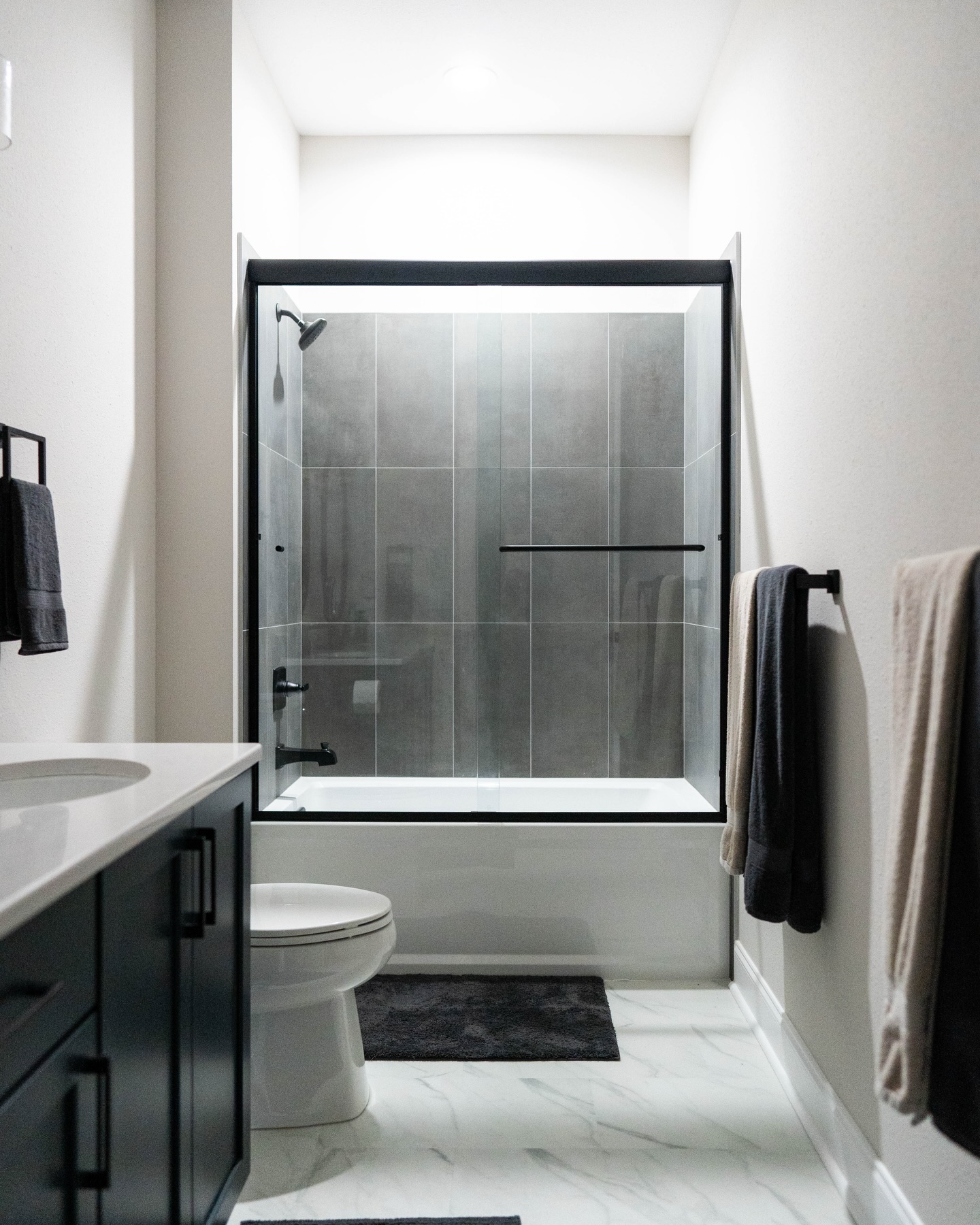 Frameless glass shower enclosure detail