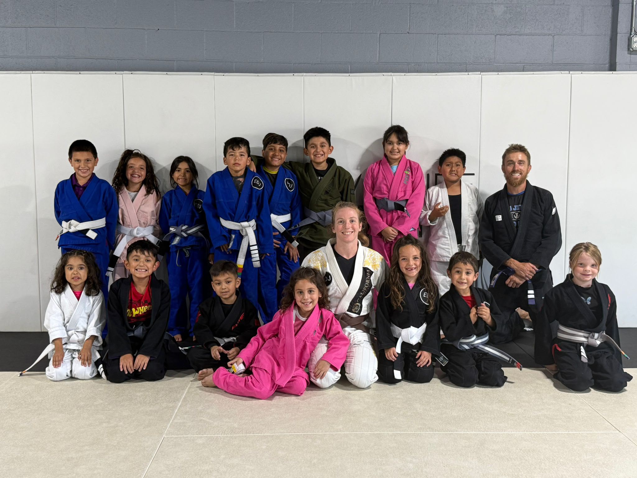 EDJ Jiu Jitsu Riverside kids and instructors on the mat - holiday promotion