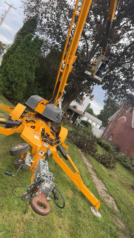 Towable aerial lift set up for tree work, Precision Grounds Tree Service
