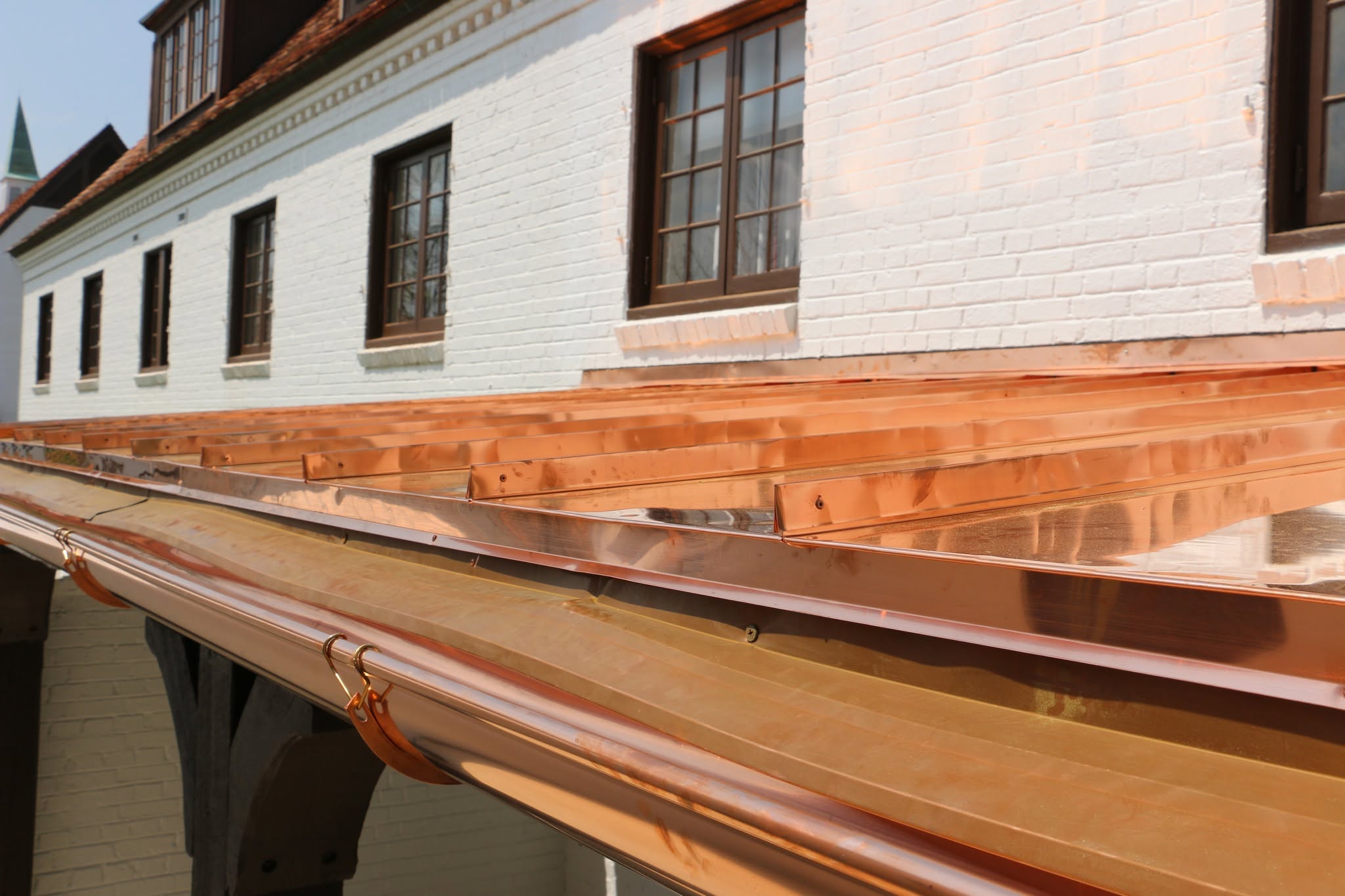 Custom copper bay window roof and copper gutter installed by McCullough Roofing