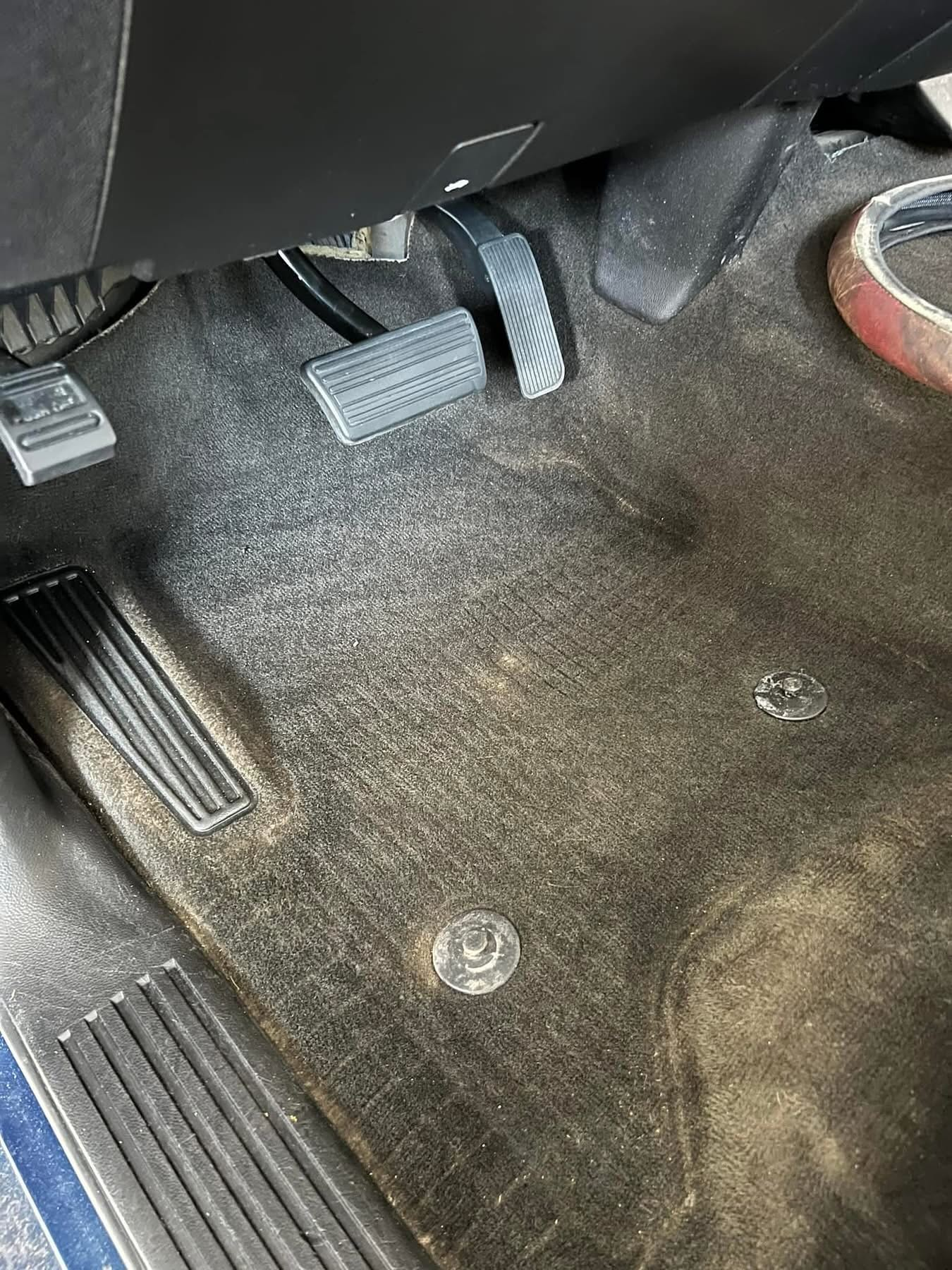 Vehicle driver footwell after interior cleaning