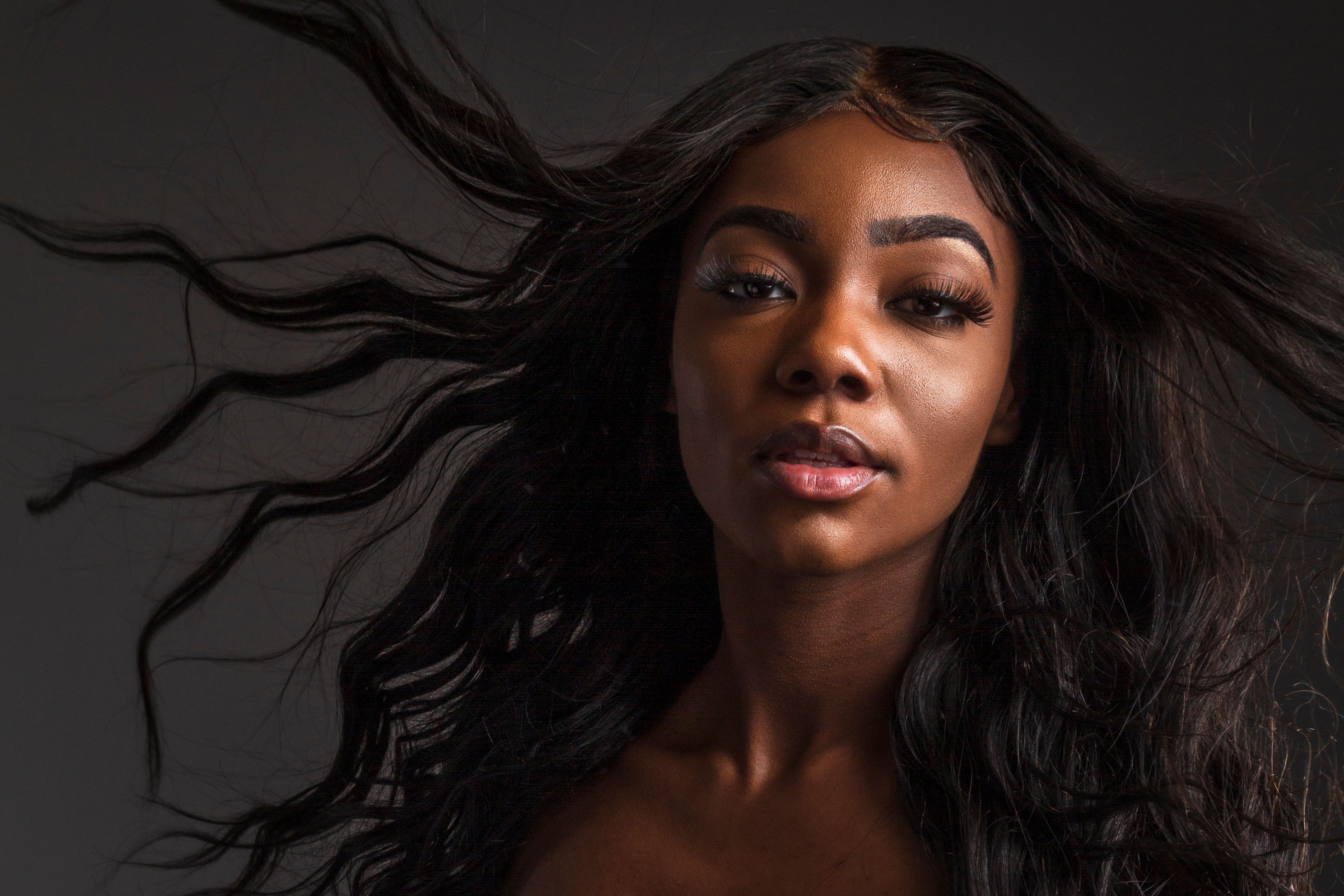 Premium virgin hair wigs model with flowing dark hair