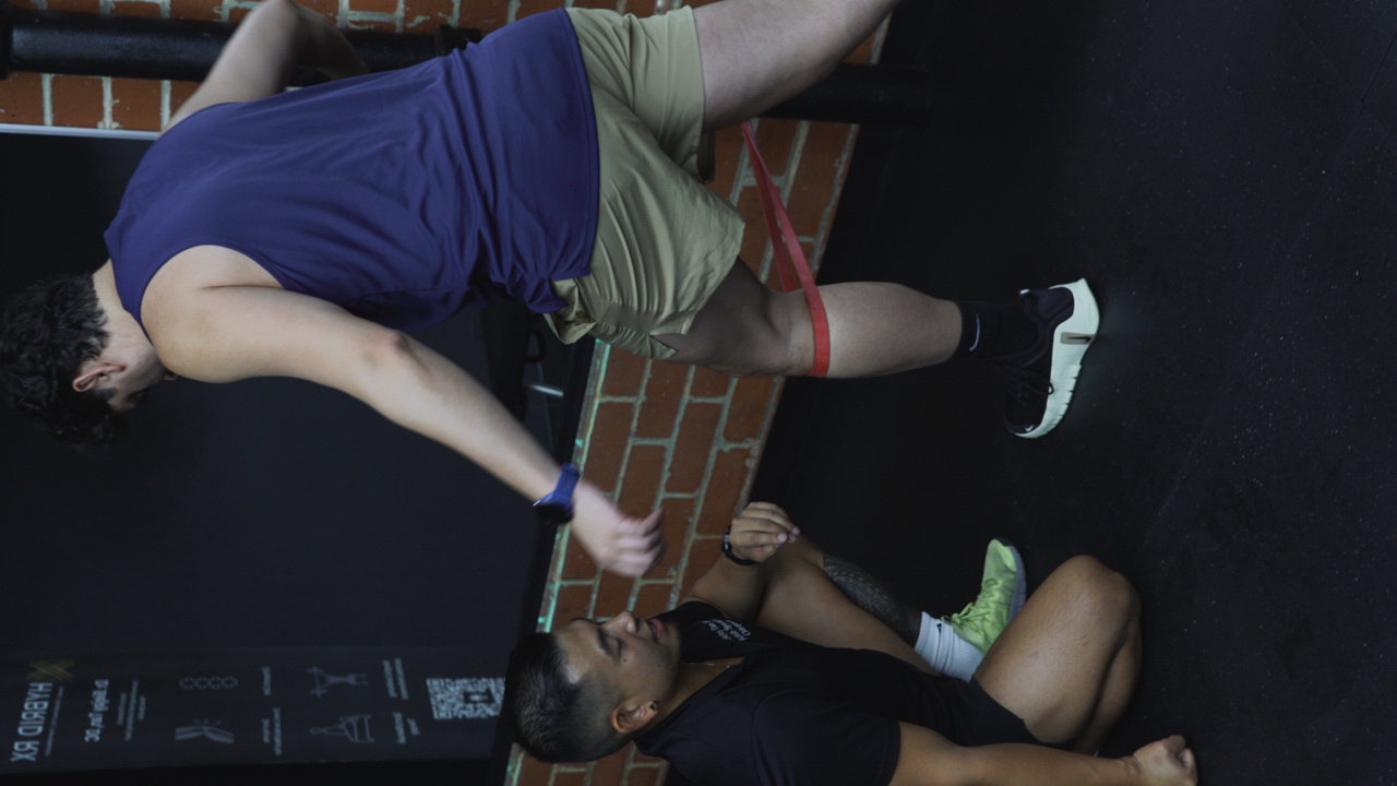 Dr. Biejay coaching resistance band movement rehab