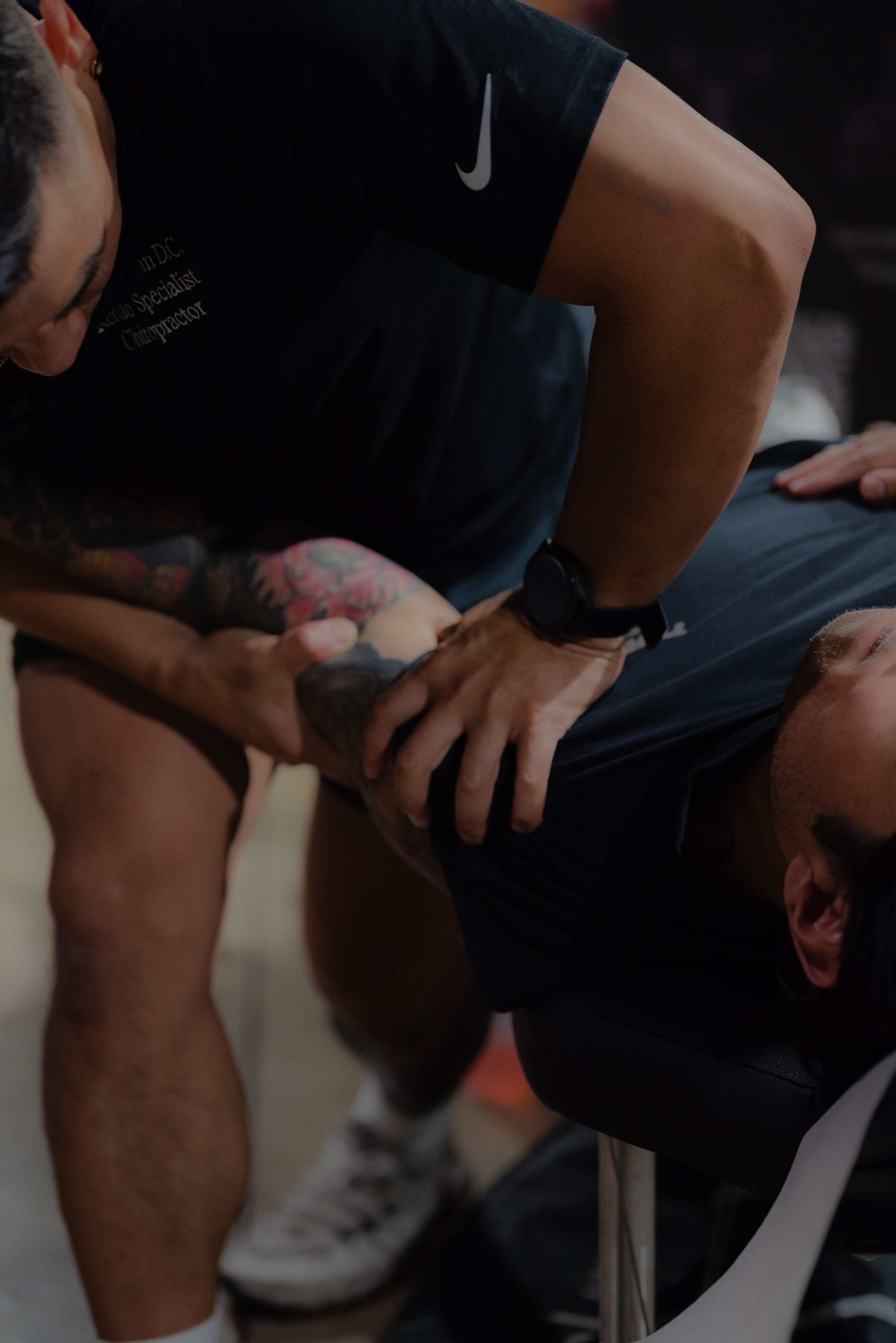 Dr. Biejay performing shoulder adjustment at HYBRID RX
