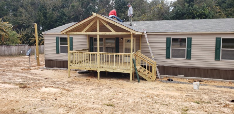 Gable roof patio cover and front porch build with Protech crew installing roofing