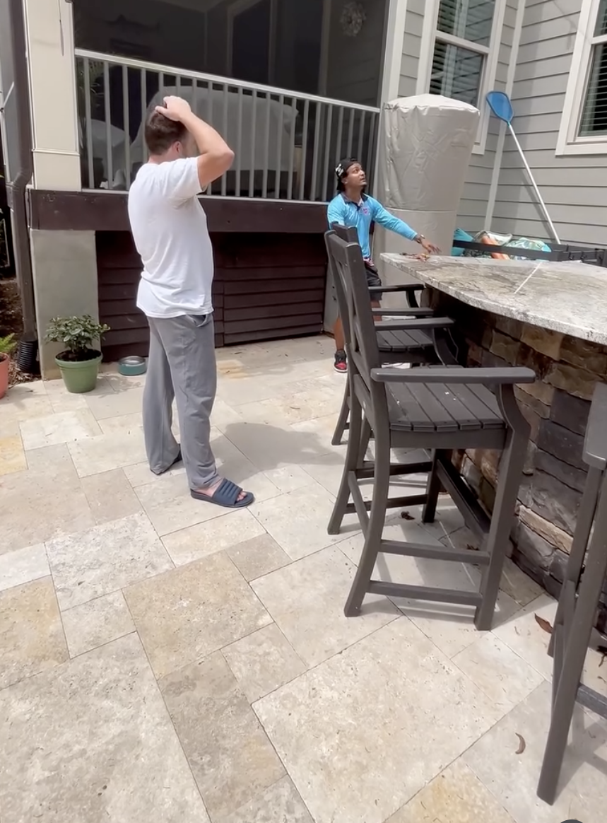 In-person assessment and upsell conversation on homeowner patio
