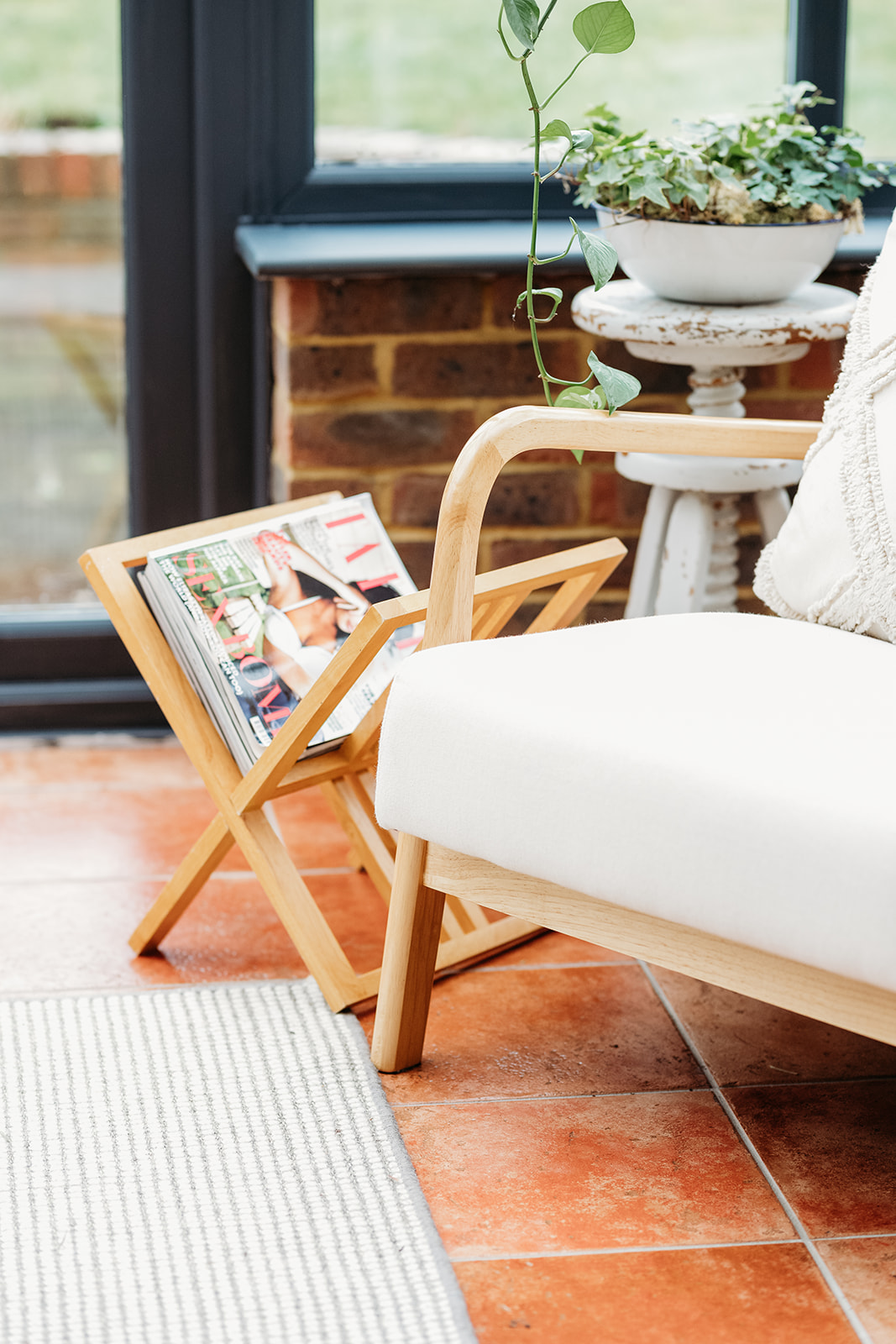 Comfortable seating area with a leadership magazine and calm ambience