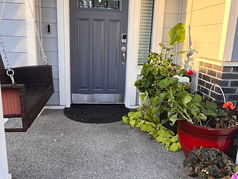 Covered Front Porch & Entry Door with Porch Swing