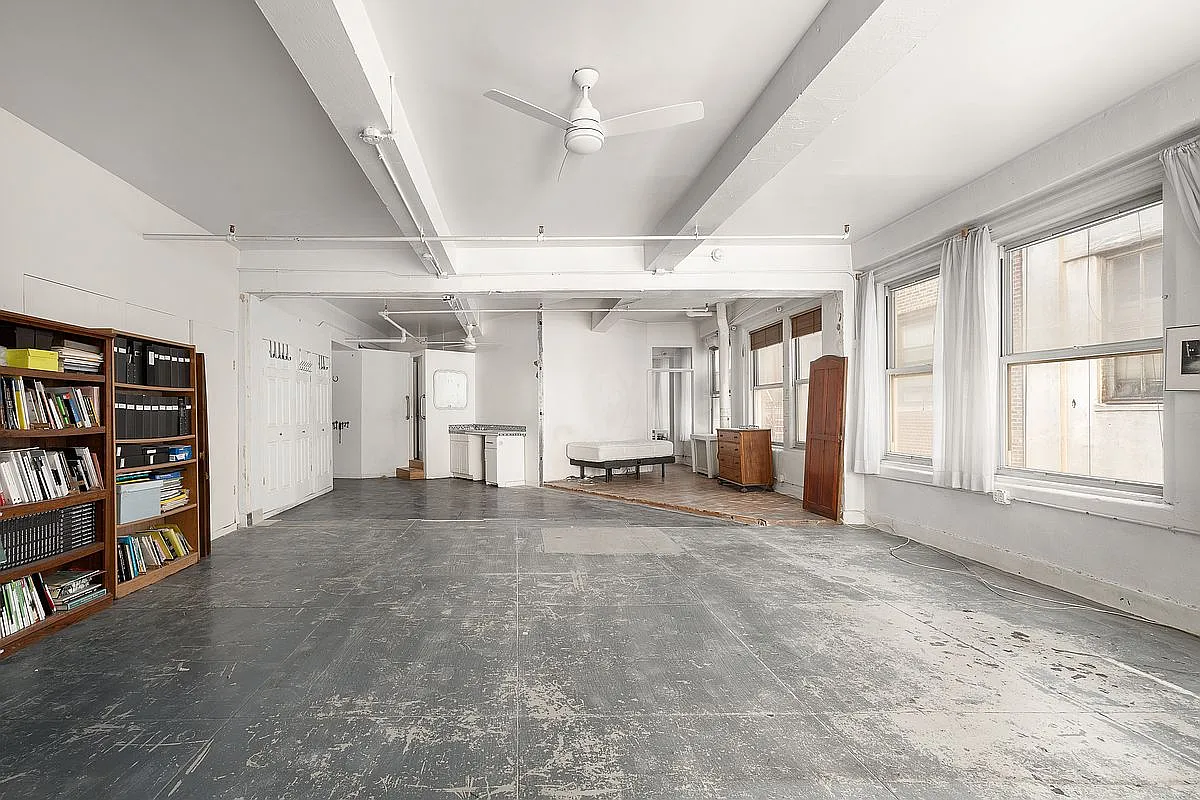 Sprawling 1,829 sq ft open loft canvas with beamed ceilings, industrial details and endless potential