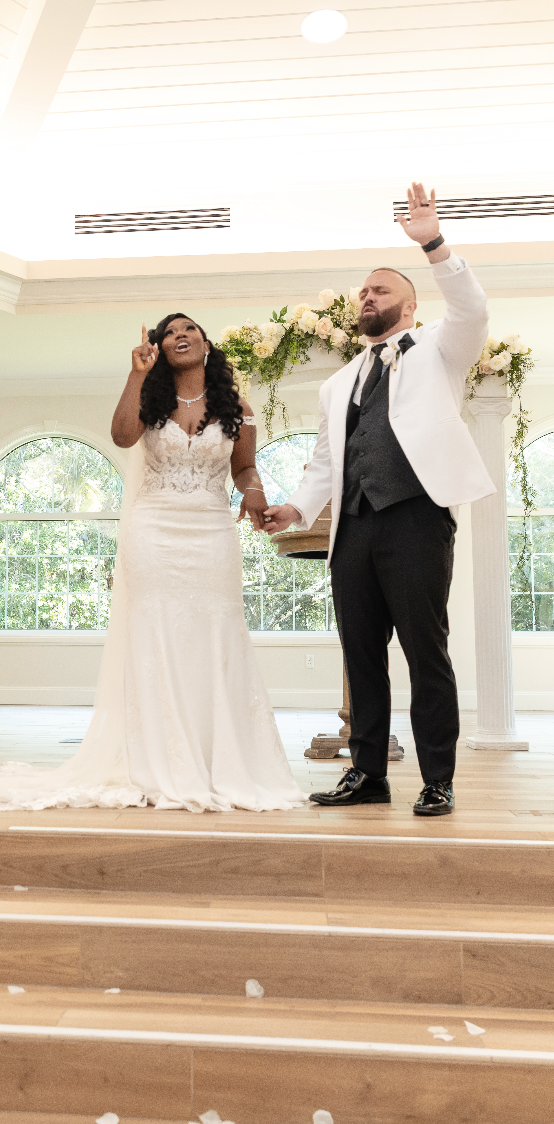 Coach Ryan and Coach Roxy wedding ceremony praising God at the altar