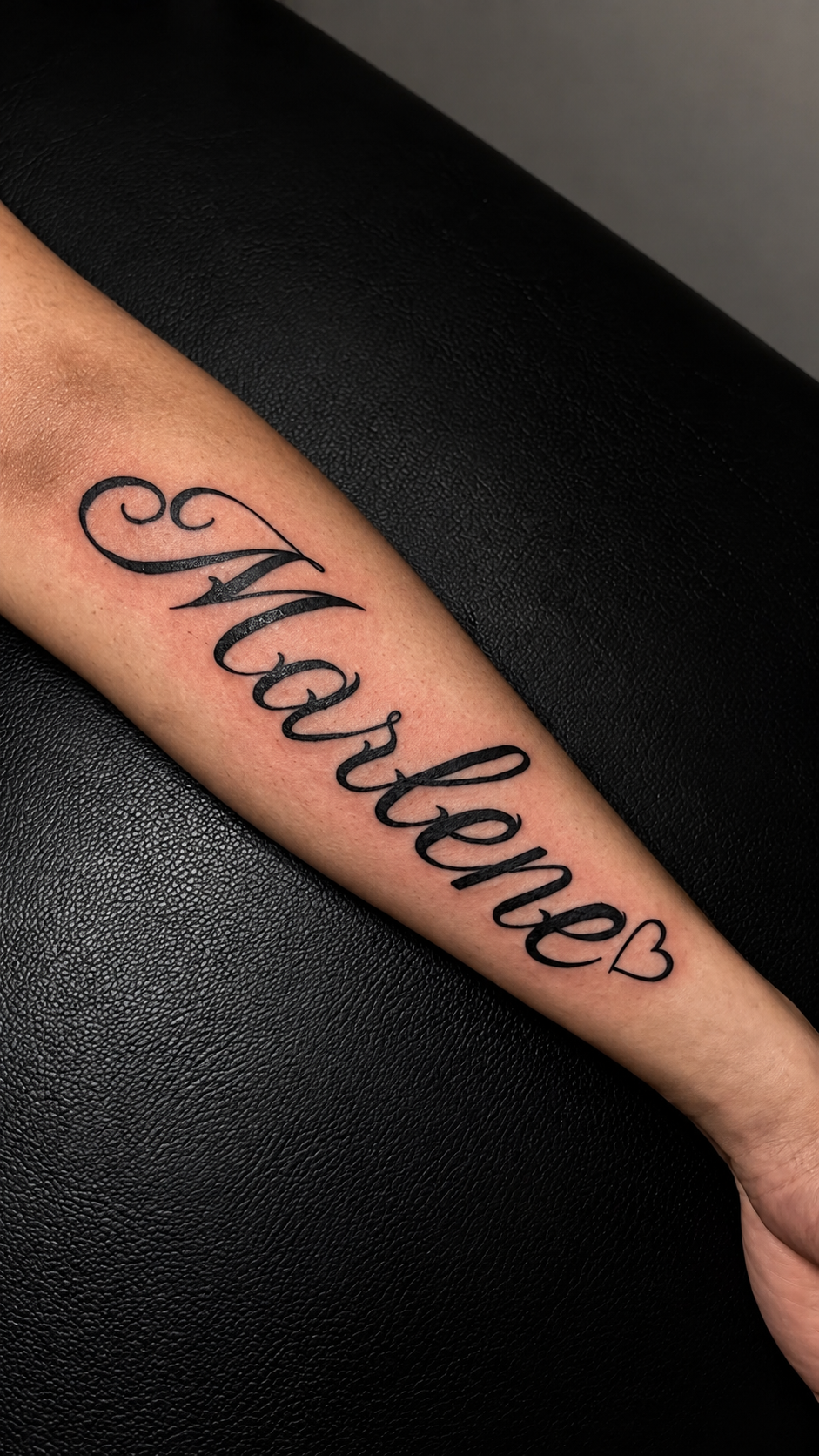 Cursive Marlene name tattoo with a small outlined heart