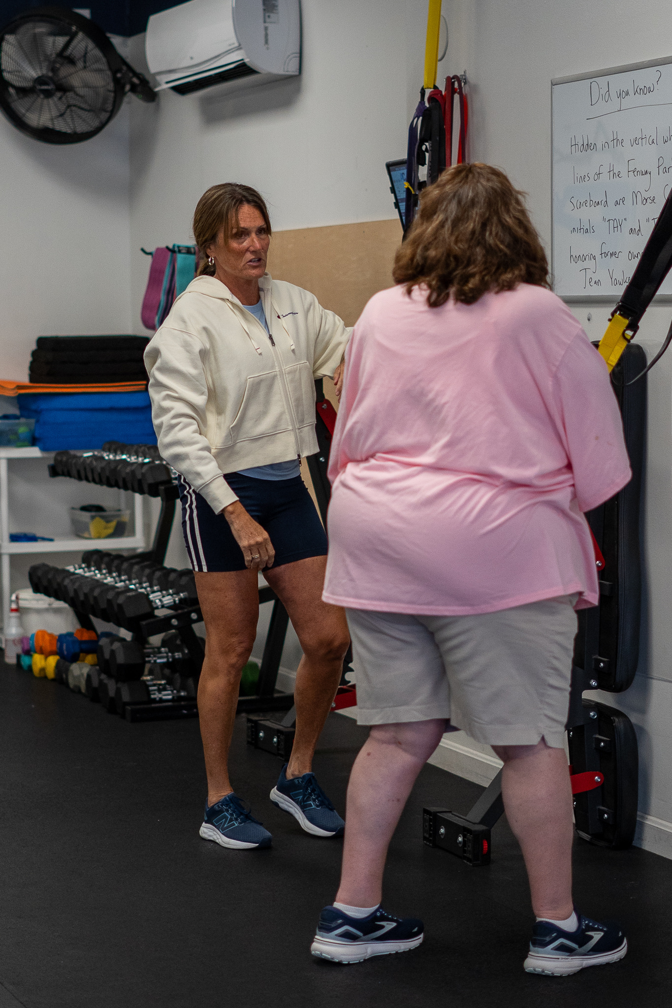 Coach Sherry guiding a member through personalized movement at Adam Clark Fitness, Brewer, ME