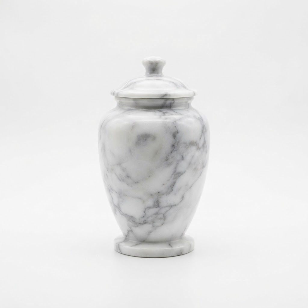 A white and gray marble cremation urn shown against a plain surface.