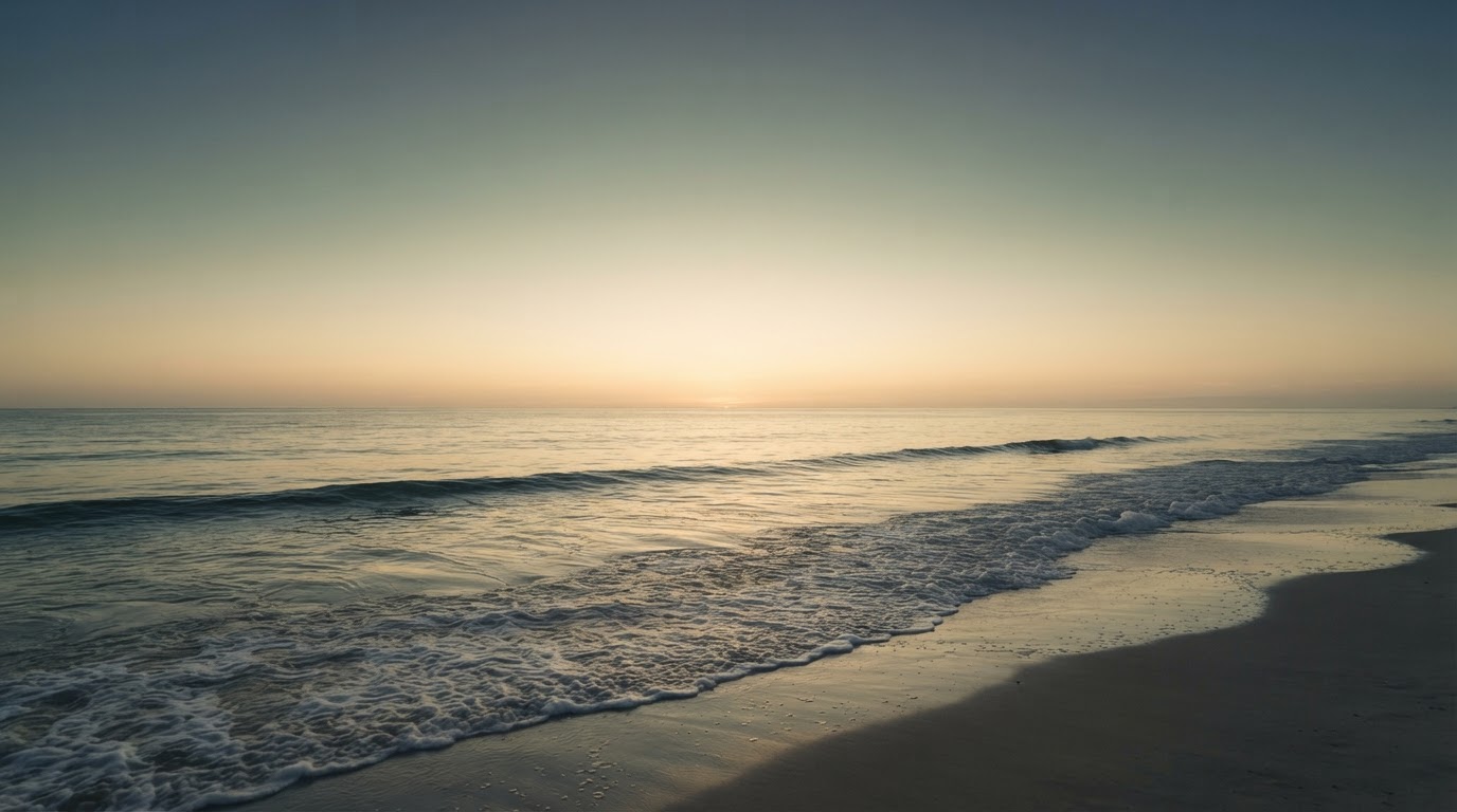 A calm golden-hour seascape with gentle waves