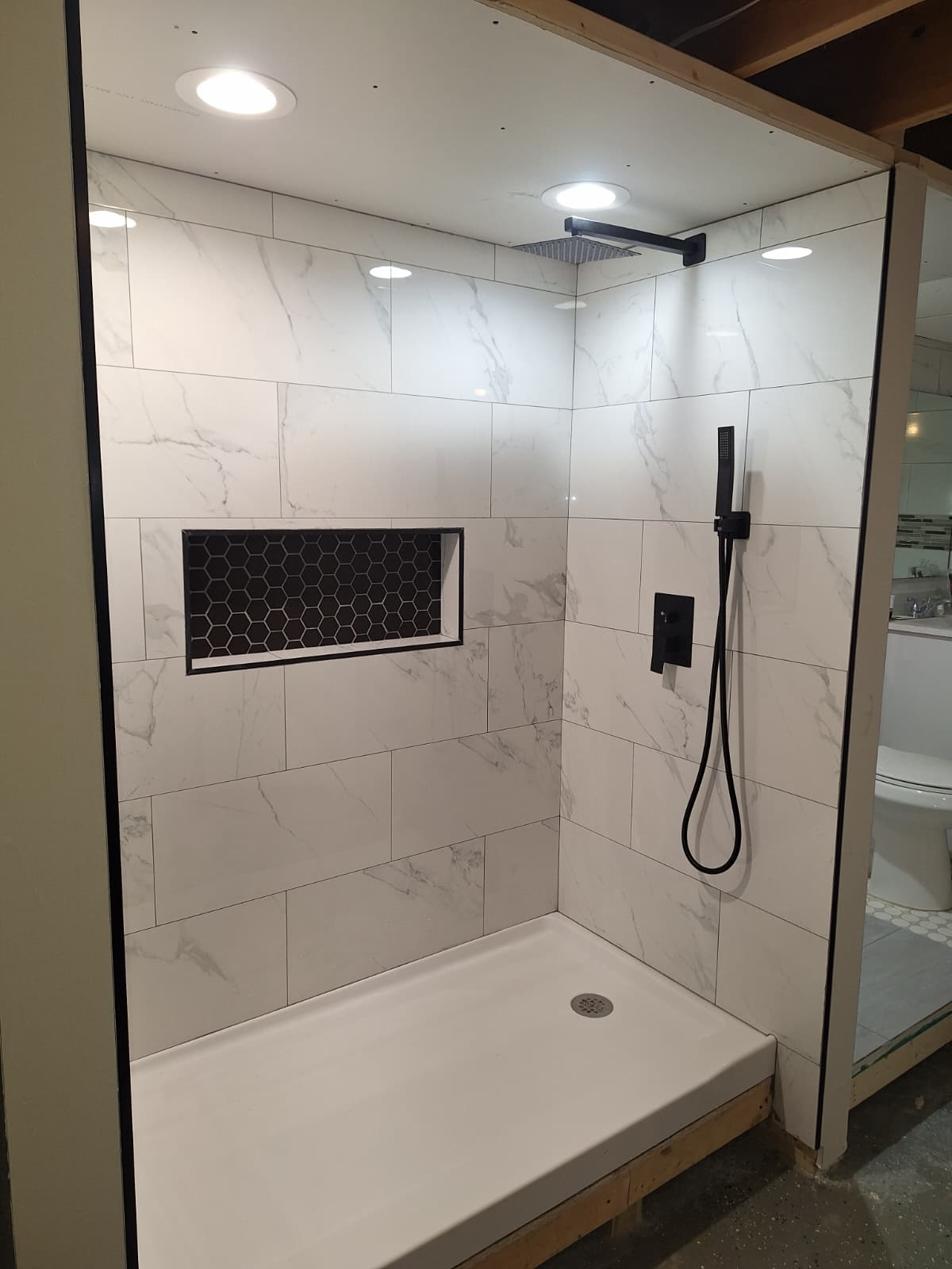 Marble Shower with Black Hex Niche