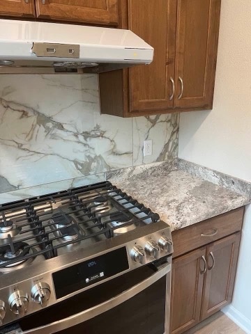Large format marble look kitchen backsplash installed by American Flooring LLC in the Sun Prairie, WI area