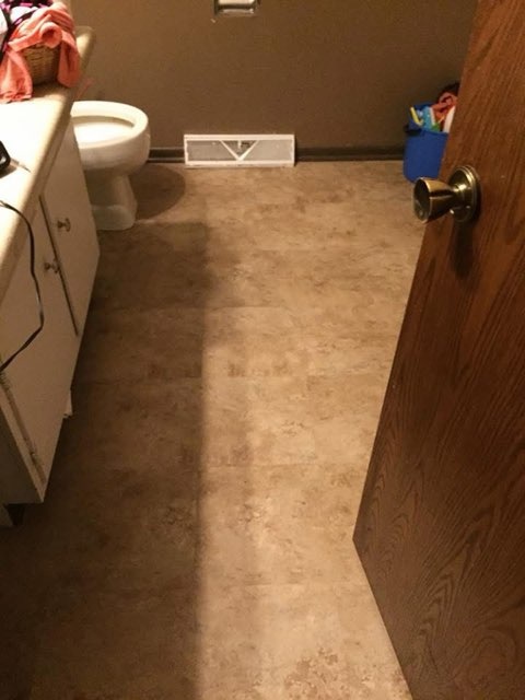 Stone look bathroom floor installed by American Flooring LLC