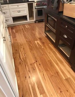 Hardwood floor installed in a kitchen by American Flooring LLC