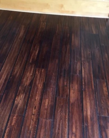 Dark plank floor installed by American Flooring LLC