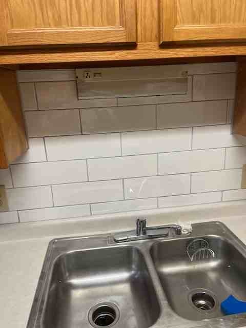 White subway tile kitchen backsplash installed by American Flooring LLC