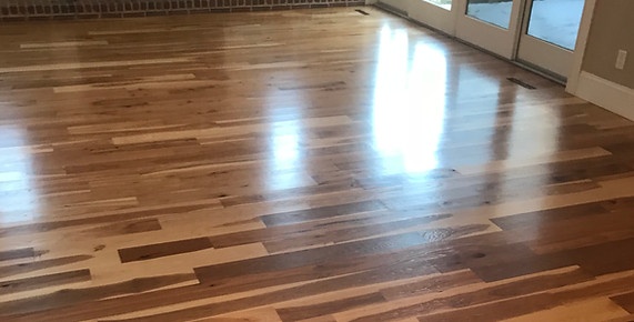 Wide hickory hardwood floor in a living room near Madison, WI, installed by American Flooring LLC