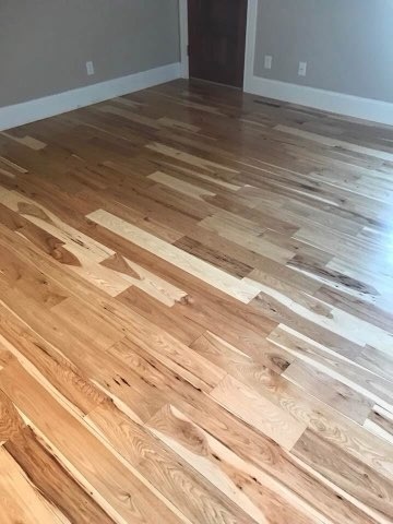 Hickory hardwood bedroom floor installed by American Flooring LLC near Madison, WI