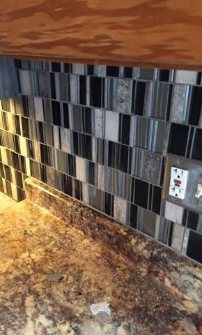 Glass and stone mosaic kitchen backsplash installed by American Flooring LLC in the Sun Prairie, WI area