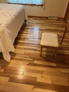 Hickory hardwood bedroom floor installed by American Flooring LLC near Madison, WI