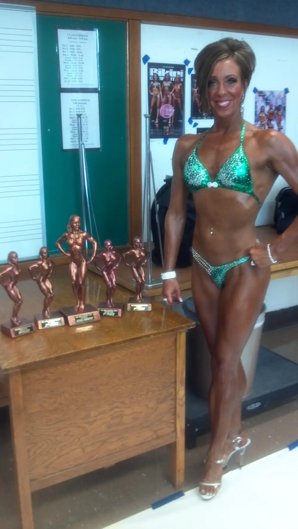 Terra smiling on stage with trophies