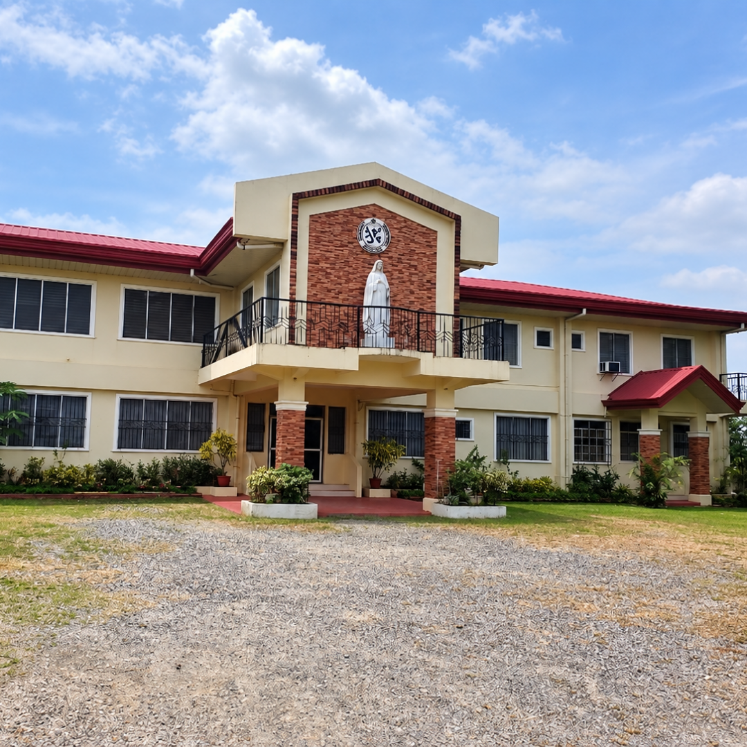 The two-story main building and front grounds of Omura Homes under a bright sky.
