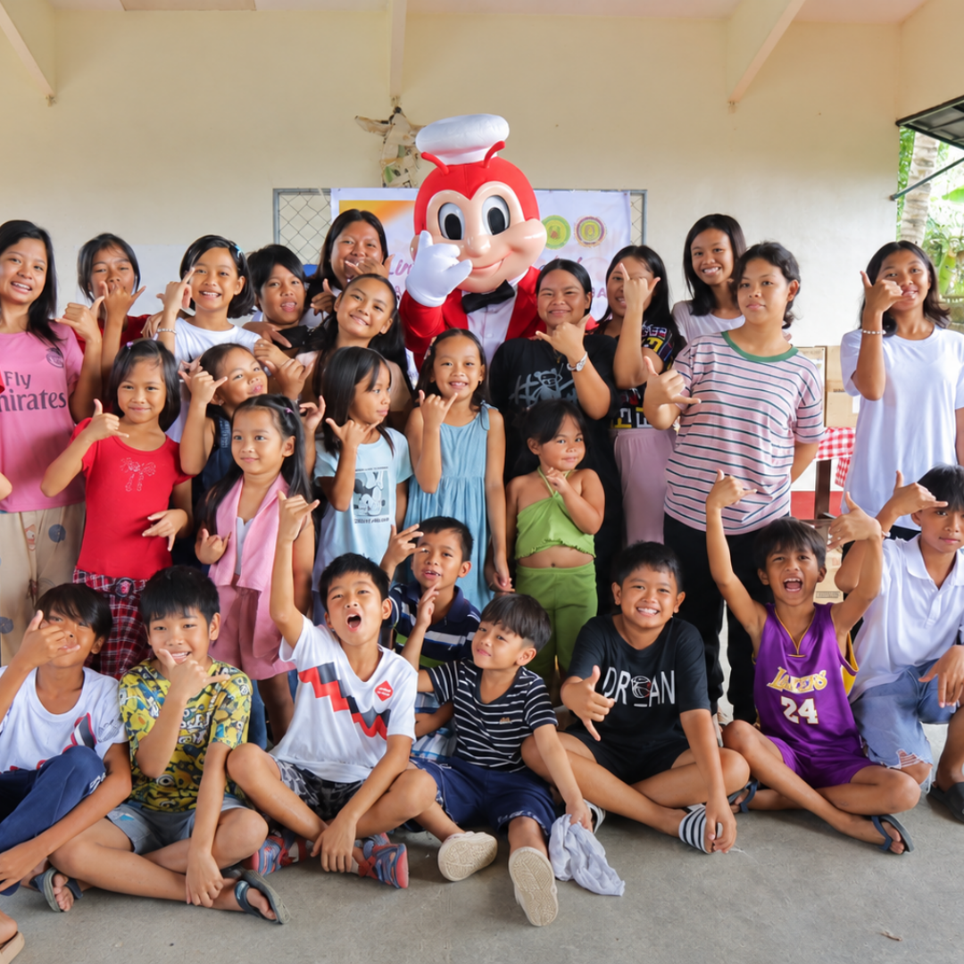 Children and youth gathered happily together during a community fellowship visit.