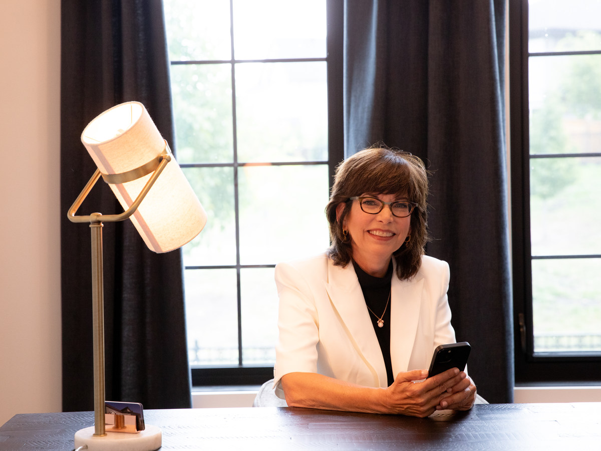 Wendy Theberge at her desk, ready to help with your real estate questions