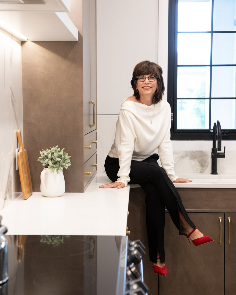Wendy Theberge in a modern Edmonton home kitchen