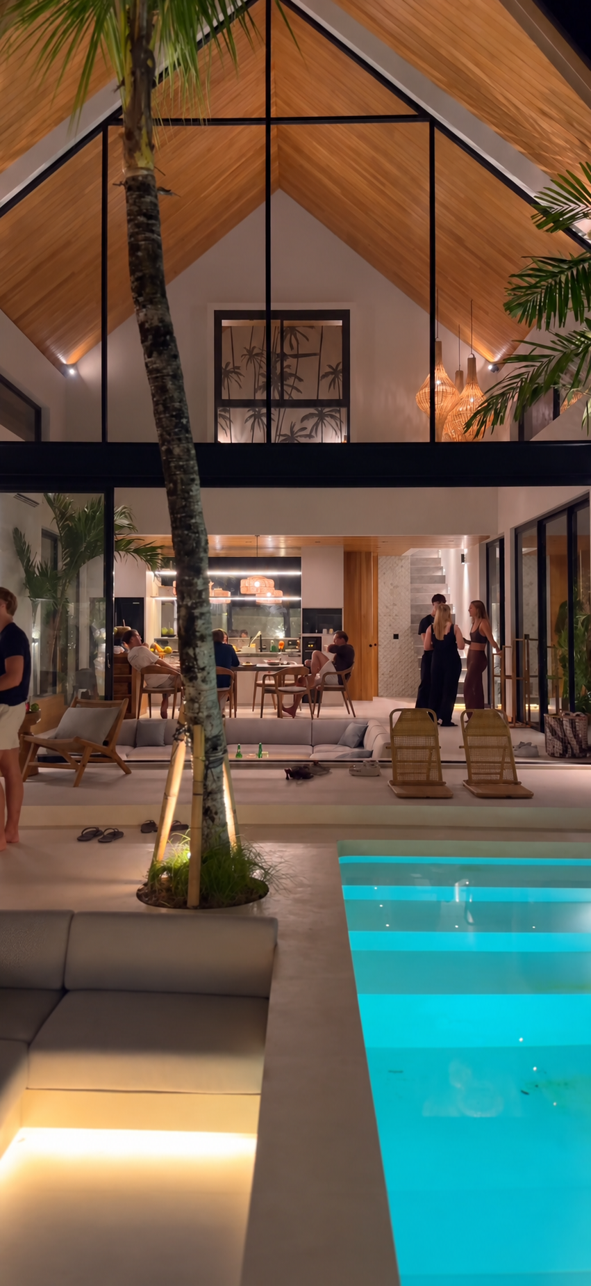 Modern luxury villa architecture and pool party at night