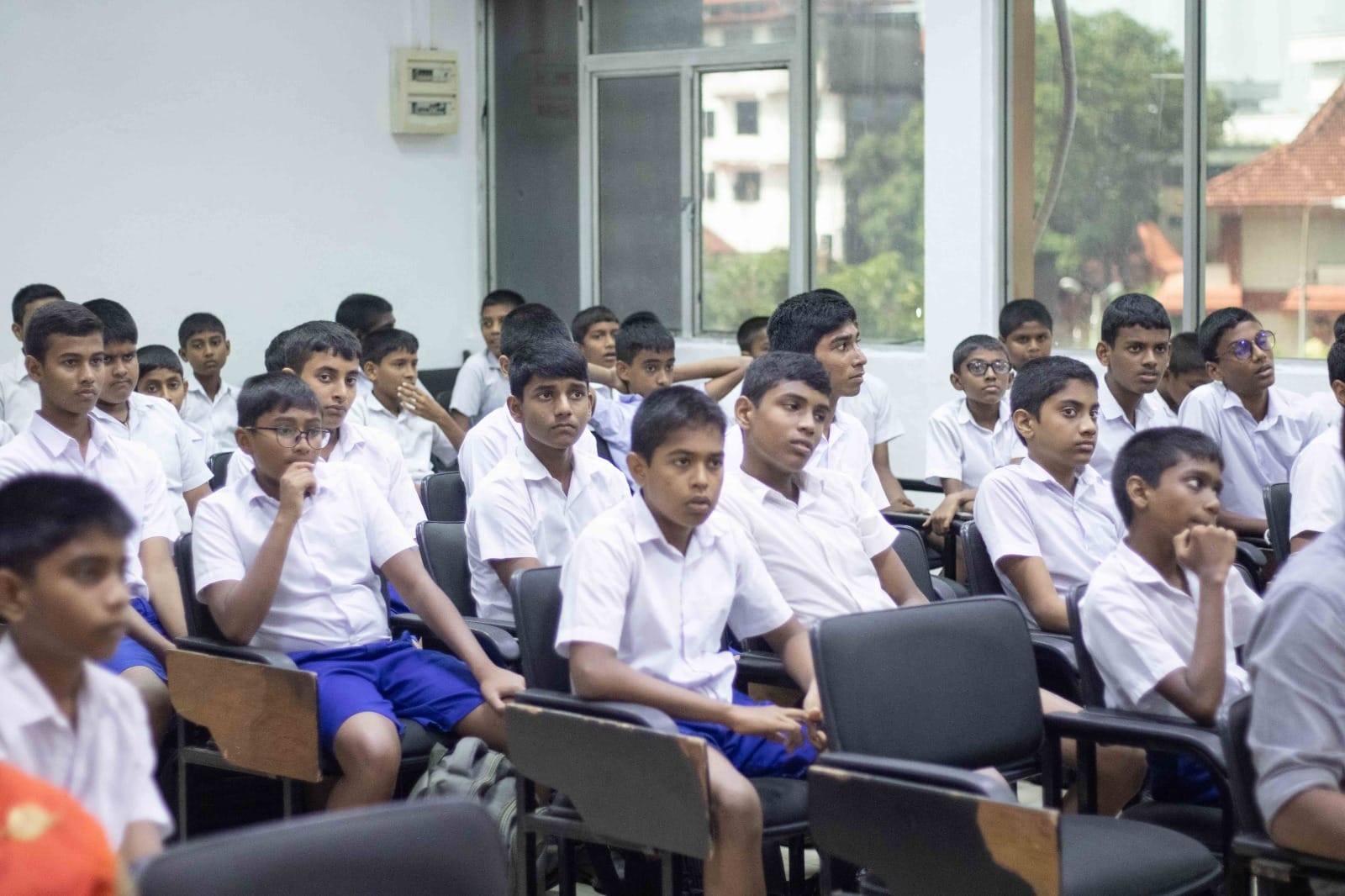 School participants seated during an intra-school audio workshop session