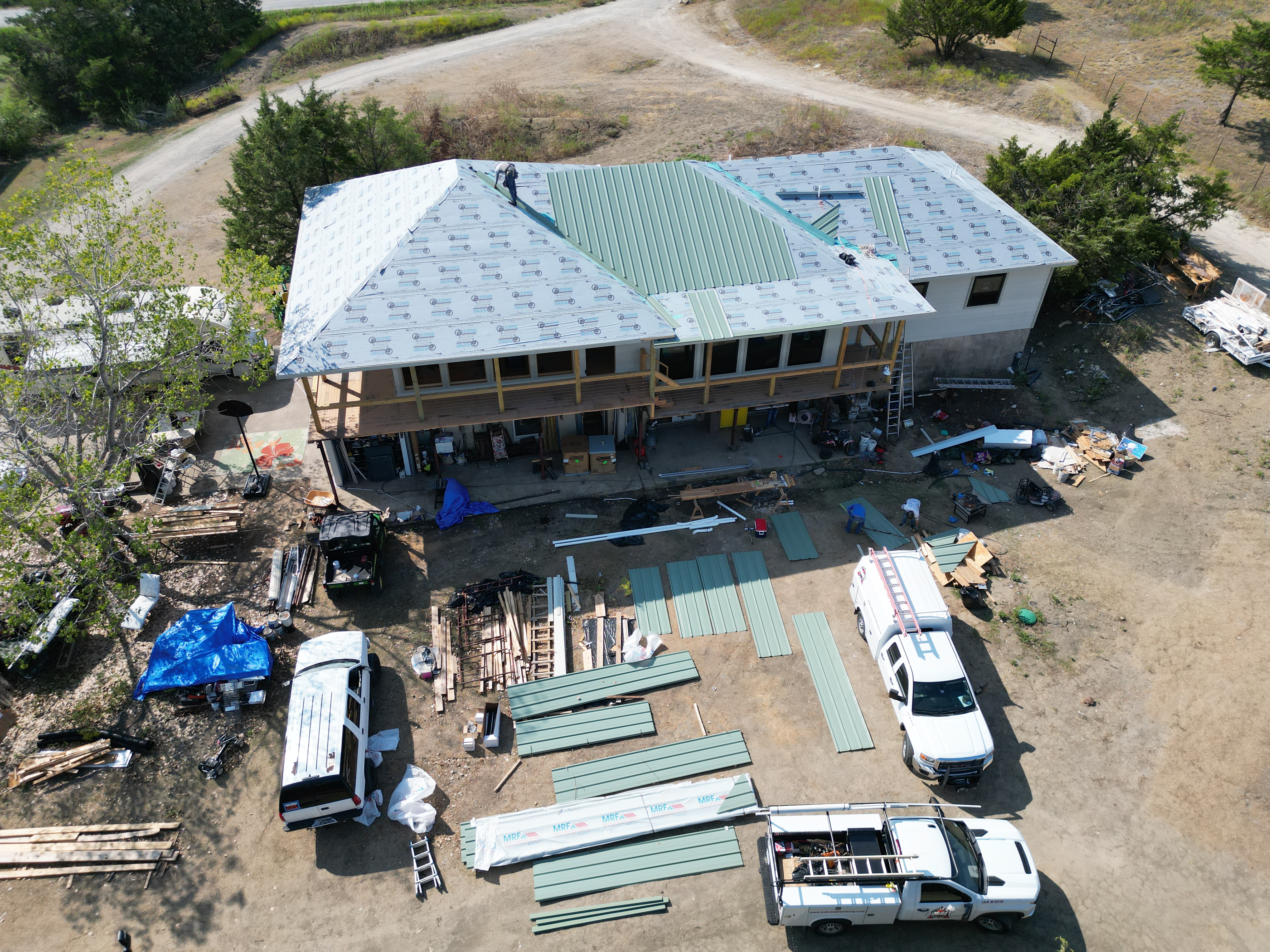 Aerial view of metal roofing installation in progress
