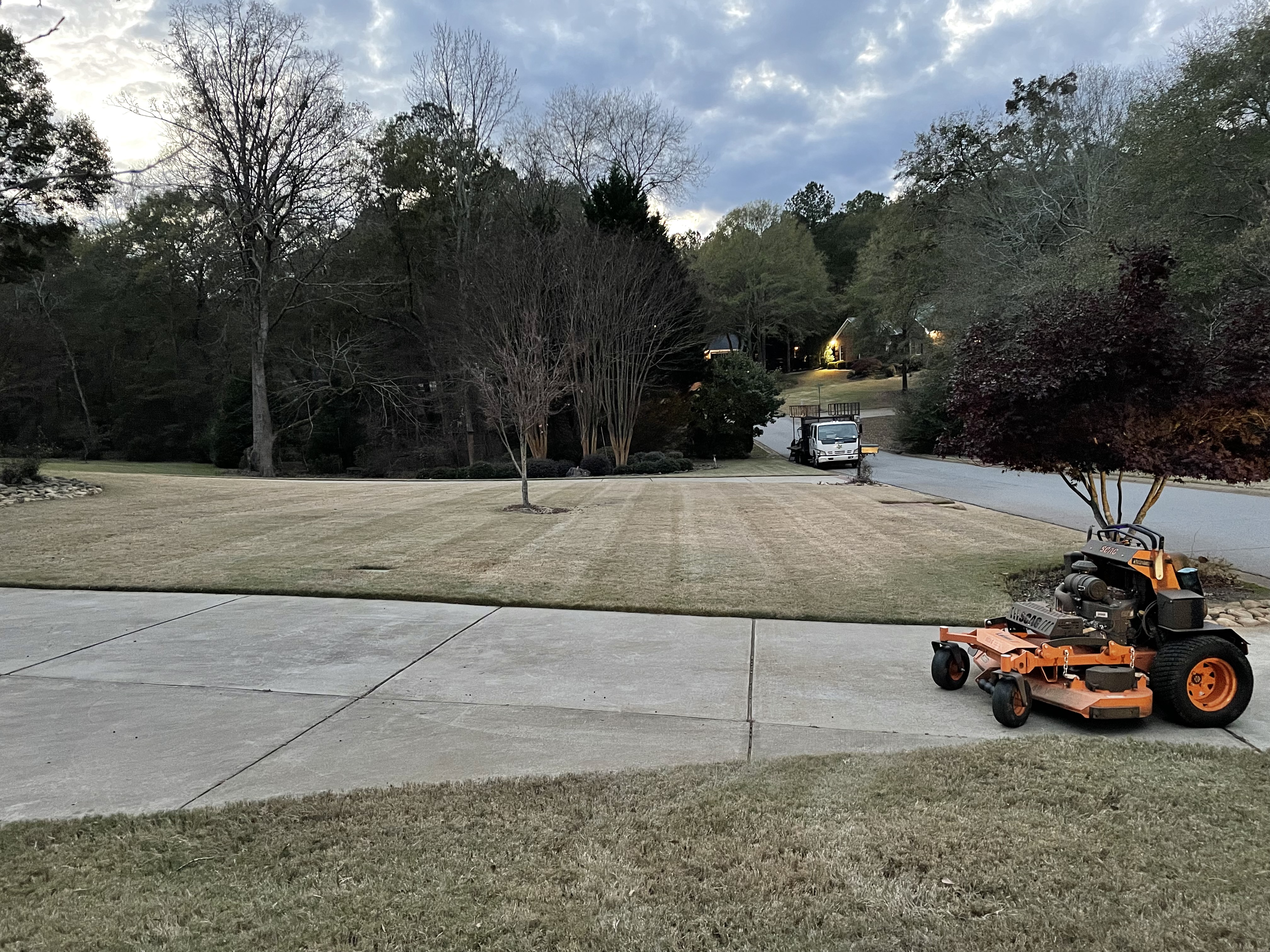 Commercial mower on a maintained lawn in the Oconee County area.