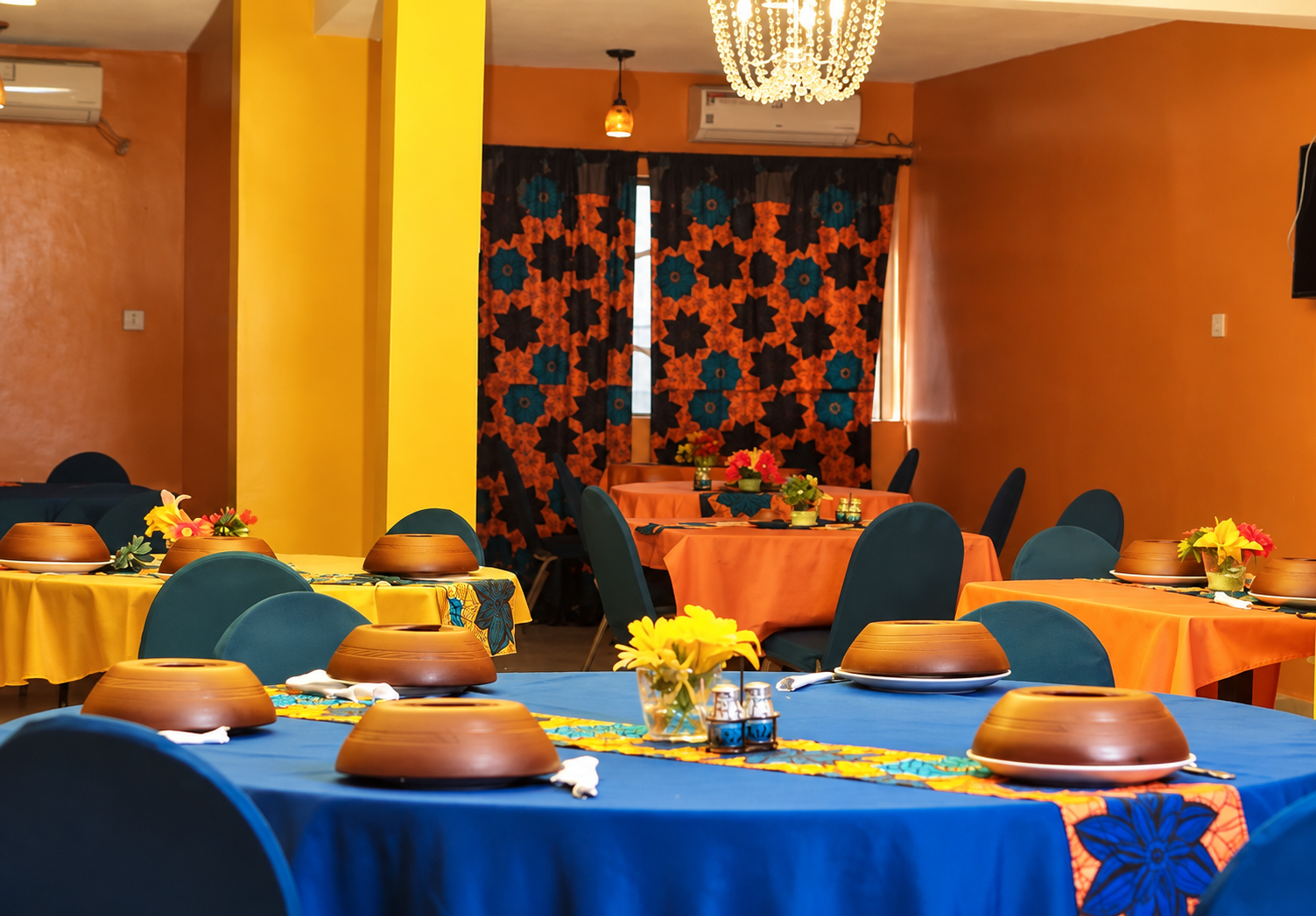 Stafford Lodge restaurant dining hall with dressed tables and chandelier