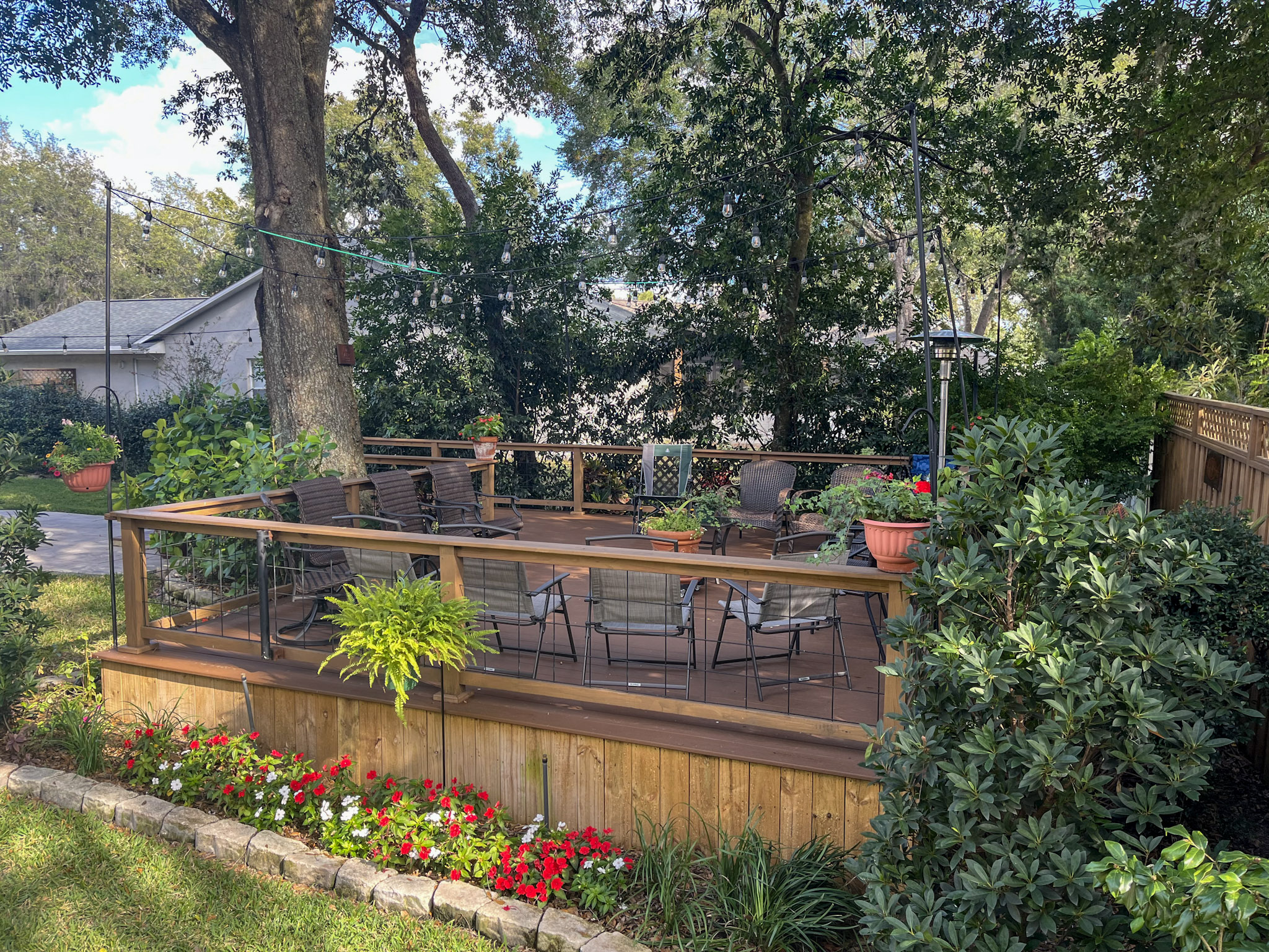 The Sanford backyard deck under the shade tree where the first gathering met