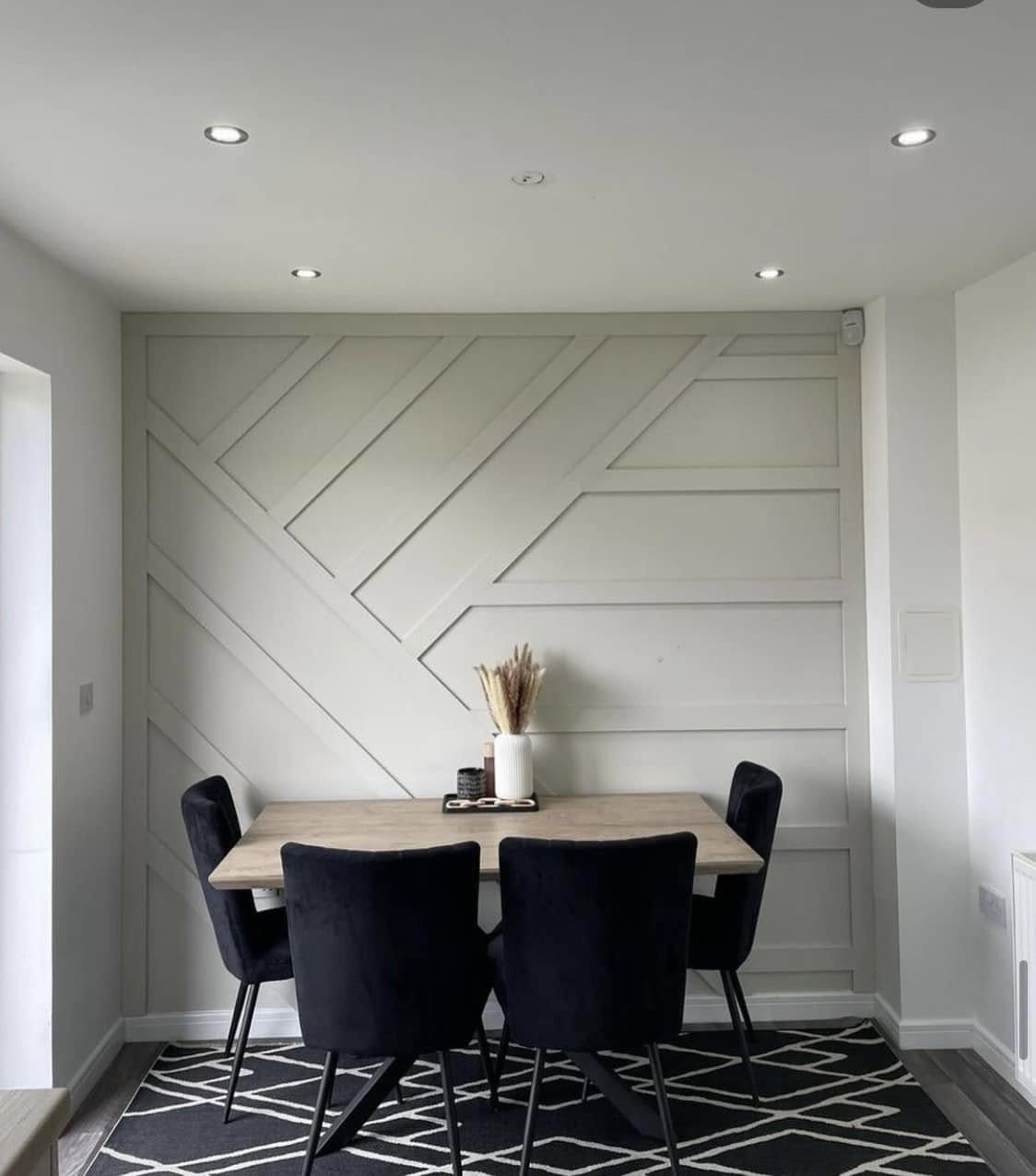 Contemporary geometric wall panelling and modern dining space by SJ Joinery & Building